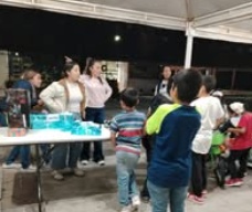Children standing together with their arms around one another