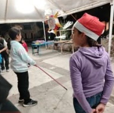Children standing together with their arms around one another