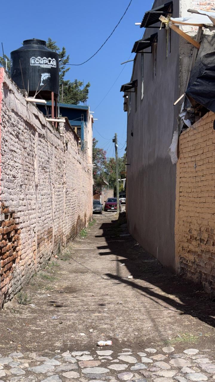 Alley between brick walls in San Miguel de Allende, Mexico