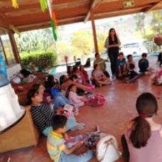 Children standing together with their arms around one another
