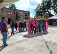 Children standing together with their arms around one another