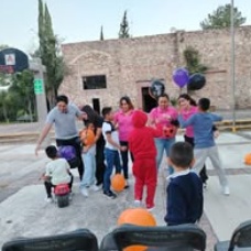 Children standing together with their arms around one another