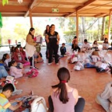 Children standing together with their arms around one another