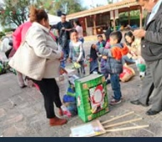 Children standing together with their arms around one another