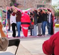 Children standing together with their arms around one another
