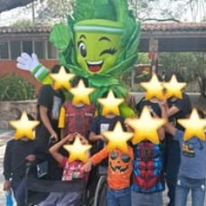 Children standing together with their arms around one another