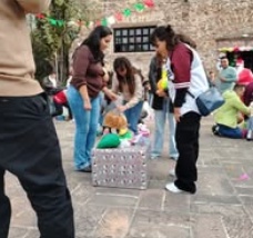 Children standing together with their arms around one another